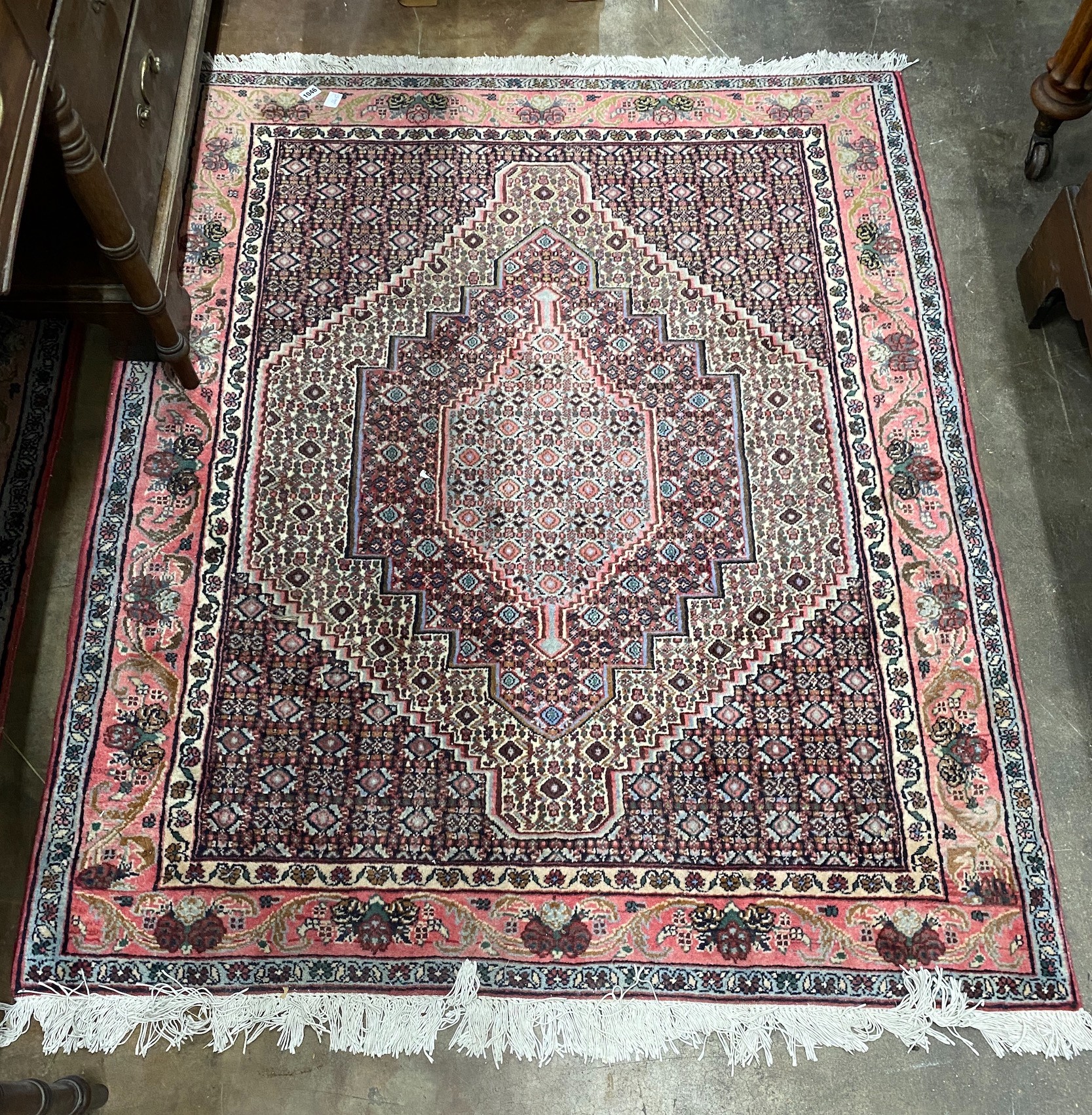 A Senneh blue ground rug, 142 x 122cm